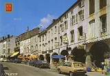Remiremont - La Grande Rue avec ses maisons à arcades