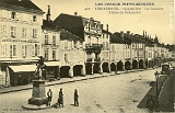 Remiremont. - Grande-Rue - Les Arcades - Statue du Volontaire